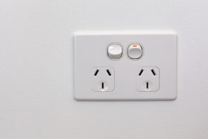 Modern Australia double power outlet on white wall