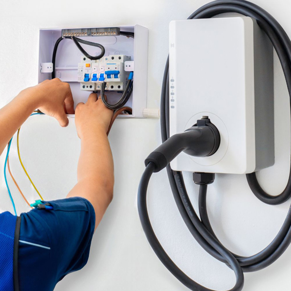 Electrician inspecting a circuit breaker panel