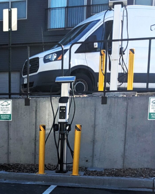 EV charger being installed on a wall